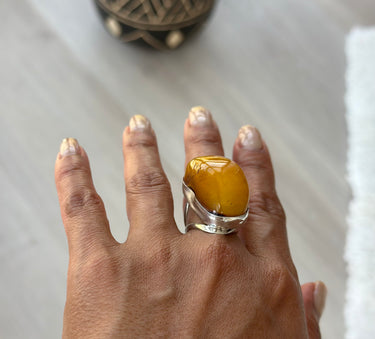curve African amber ring