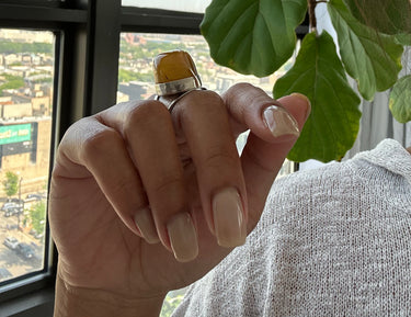 curve African amber ring