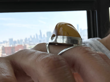 curve African amber ring