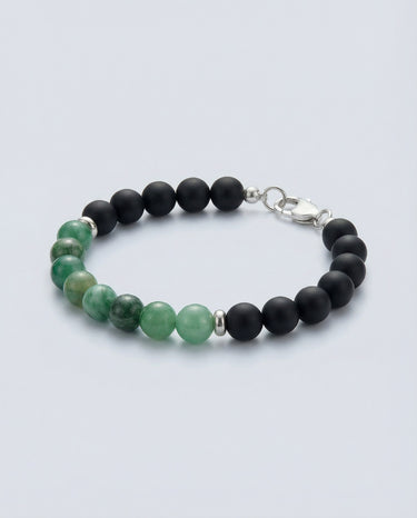 A top-down view of an 8mm Emerald and Matte Black Onyx bracelet, showcasing the seamless transition between the green gemstone and black onyx beads.

