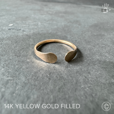 gold cuff toe ring, adjustable, hammered tips and texture, on dark background