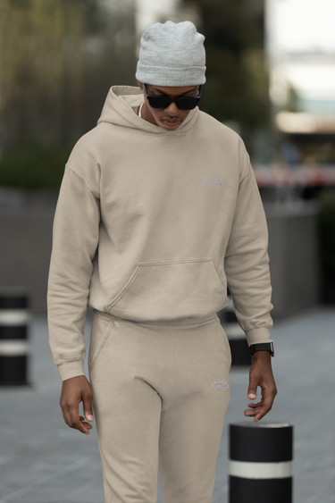 model wearing pullover hoodie and sweatpants with ready never logo