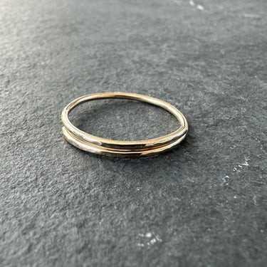 Gold ring on a dark gray surface