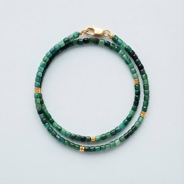 A 3mm faceted tourmaline cube wrap bracelet coiled with 14k gold-filled accent beads and a high-polish gold lobster clasp.
