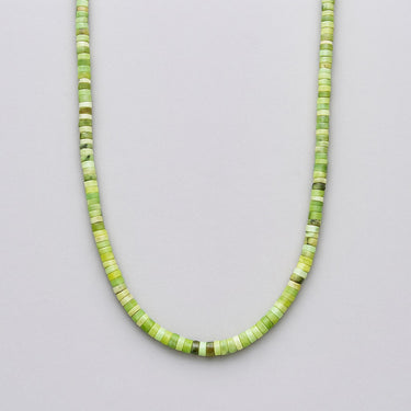 Front view of a men’s necklace featuring 4mm African green chrysoprase heshi beads with a single sterling silver accent bead on a white background.

