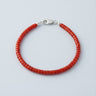 A 4mm vibrant red agate heishi bead bracelet with a high-polish silver lobster clasp, displayed against a light grey background.
