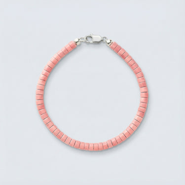 A 4mm Rhodonite heishi bead bracelet with a high-polish silver lobster clasp, displayed against a light grey background.
