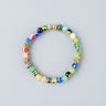 A 6mm handmade Millefiori glass bead bracelet with vibrant multi-color patterns and a single 14K gold-filled accent bead.
