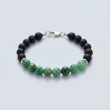 An 8mm bead bracelet featuring vibrant green Emerald center beads and matte black onyx round beads with a high-polish silver lobster clasp.

