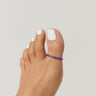 Purple anodized aluminum big toe ring on toes — smooth rounded fit, COLORS Collection by Clay & Chloe Jewelry.