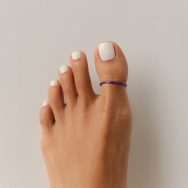 Direct angle of purple anodized aluminum big toe ring — smooth finish and comfortable everyday fit.