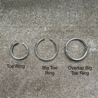 Three types of toe rings labeled 'Toe Ring', 'Big Toe Ring', and 'Overlap Big Toe Ring' on a concrete surface.