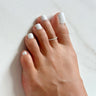 foot model wearing twisted metal sterling Silver Adjustable mini Toe Ring