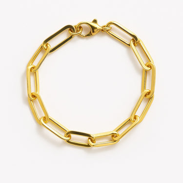 A structural women's 14K gold-filled paperclip link bracelet with a high-polish finish and a matching lobster clasp, displayed in a circular arrangement against a white background.

