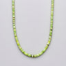 Front partial view of a women's necklace featuring 4x2mm African green chrysoprase heishi disc beads on a white background.

