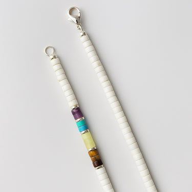 A macro detail view of the multi-stone heishi beads meeting professional-grade sterling silver hardware, featuring a secure and high-polish lobster clasp.

