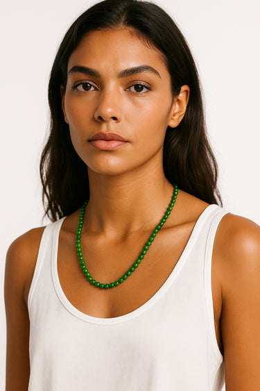 A portrait-view lifestyle shot of a model wearing the 6mm Jade necklace, highlighting its refined presence and modern luxury aesthetic.
