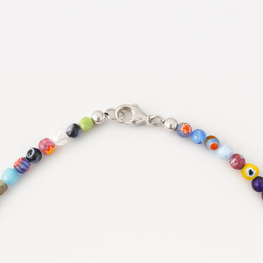 A close-up view of the multi-colored Millefiori glass beads meeting professional-grade sterling silver hardware, showcasing a modern, refined edge.
