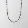 A professional studio hero shot of the women's 6mm handmade Millefiori glass necklace curved in a U-shape against a neutral background, highlighting the uniform scale and intricate floral details.

