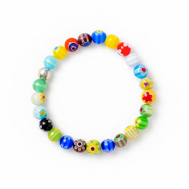 A studio hero shot of a 8mm handmade Millefiori glass bead bracelet featuring a sterling silver accent bead, showcasing vibrant multi-colored floral patterns.
