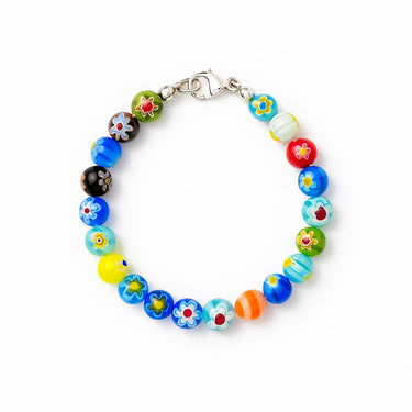 A studio hero shot of an 8mm handmade Millefiori glass bead bracelet with a sterling silver clasp, highlighting the intricate floral detail and timeless craftsmanship of the glass beads.
