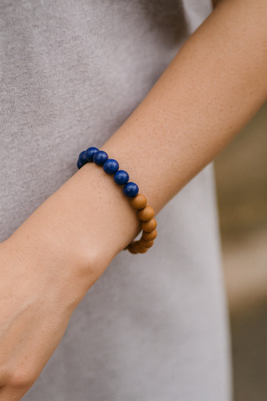A close-up lifestyle view of the 8mm mixed bead bracelet on a model’s wrist, emphasizing its versatile, bohemian-inspired style for everyday wear.

