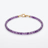 A studio product shot of a women's 3mm natural faceted amethyst cube bracelet with 14k gold-filled lobster clasp.