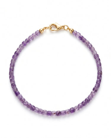 A studio product shot of a women's 3mm natural faceted amethyst cube bracelet with 14k gold-filled lobster clasp on a white background.