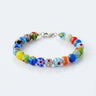 A studio product shot of an 8mm handmade Millefiori glass bead bracelet with a sterling silver clasp, highlighting the intricate floral detail and timeless craftsmanship of the glass beads.
