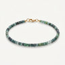 A studio product shot of a women's 3mm natural faceted tourmaline cube bead bracelet with a 14K gold-filled clasp, highlighting the multi-tonal deep green and earthy gemstone hues.