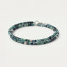 A studio product shot of a women's 3mm natural faceted tourmaline cube wrap bracelet featuring sterling silver bead accents, highlighting the multi-tonal green gemstones and elegant layered design.