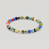 A studio product shot of a 6mm handmade Millefiori glass bead stretchy  bracelet featuring a 14K gold-filled accent bead, showcasing vibrant multi-colored floral patterns.