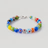 A studio product shot of an 8mm handmade Millefiori glass bead bracelet with a sterling silver clasp, highlighting the intricate floral detail and timeless craftsmanship of the glass beads.