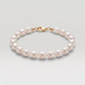 A studio product shot of a 7-8mm natural white baroque freshwater pearl bracelet with a 14K gold-filled clasp, highlighting the individual character and high-shine finish of each pearl.
