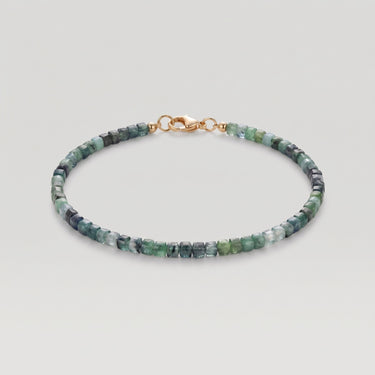 A studio product shot of a women's 3mm natural faceted tourmaline cube bead bracelet with a 14K gold-filled clasp, highlighting the multi-tonal deep green and earthy gemstone hues.