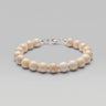 A studio product shot of a women's 8mm natural fossil jasper bead bracelet with a sterling silver lobster clasp, highlighting the organic earth-toned patterns.