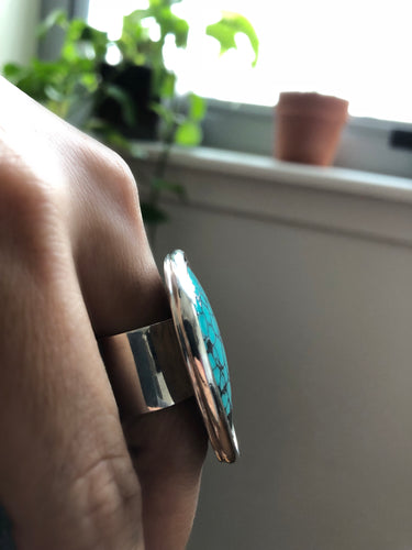 Side view of the sterling silver ring band, showing the height of the "moat" setting and the double-walled construction.