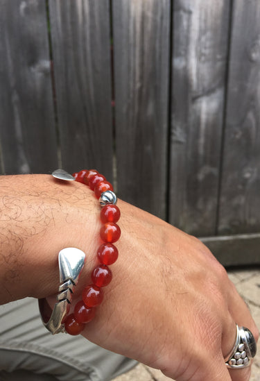 carnelian bead bracelet with silver accent on model