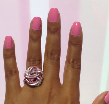 Pink and silver color anodized aluminum wire wrap ring.