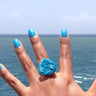 Turquoise anodized aluminum wire wrap ring.

