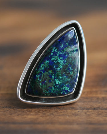 Close-up of blue and green chrysocolla stone set in sterling silver ring
