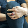 Front view of oval Carnelian Wave Ring with hammered sterling silver wire-wrapped setting.