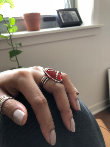 Side view of oval Carnelian Wave Ring showing sculptural hammered sterling silver wire wrap