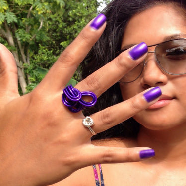 Purple color anodized aluminum wire wrap ring. 
