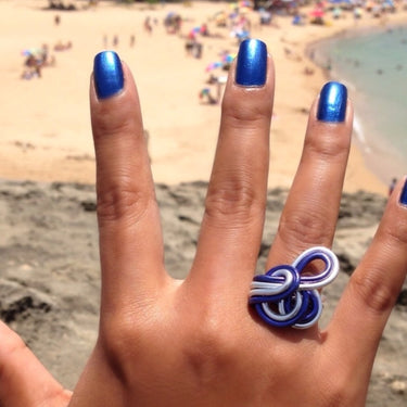 Dark blue and silver color anodized aluminum wire wrap ring. 
