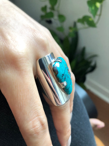 Turquoise statement ring in sterling silver worn on hand