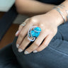 Front view of Phuket Turquoise Wave Ring with hammered sterling silver wire-wrapped setting