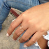 Model wearing Cairo geometric open-end ring set with triangle-shaped fronts.
